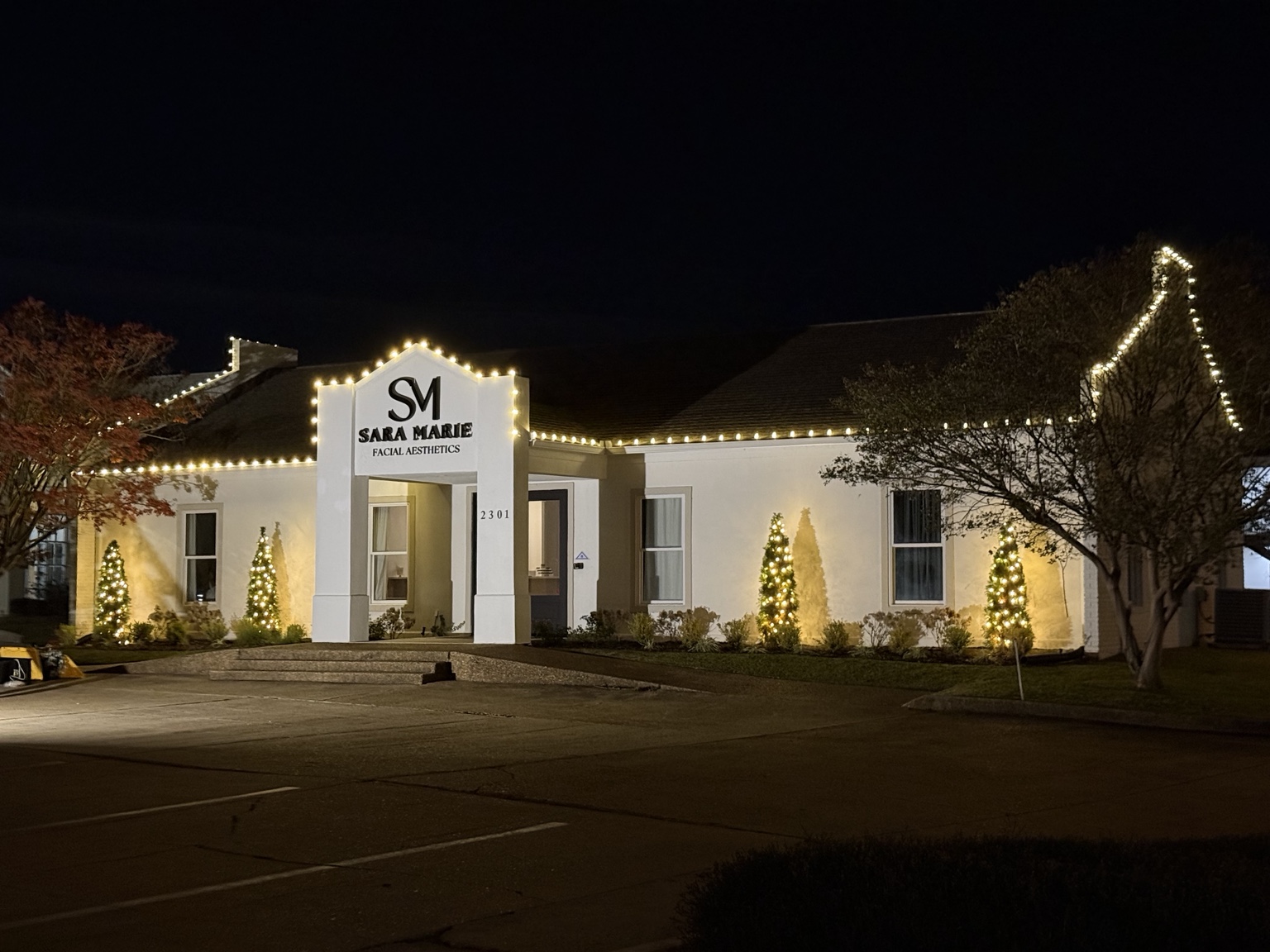 Commercial office decorated with warm white Christmas lights