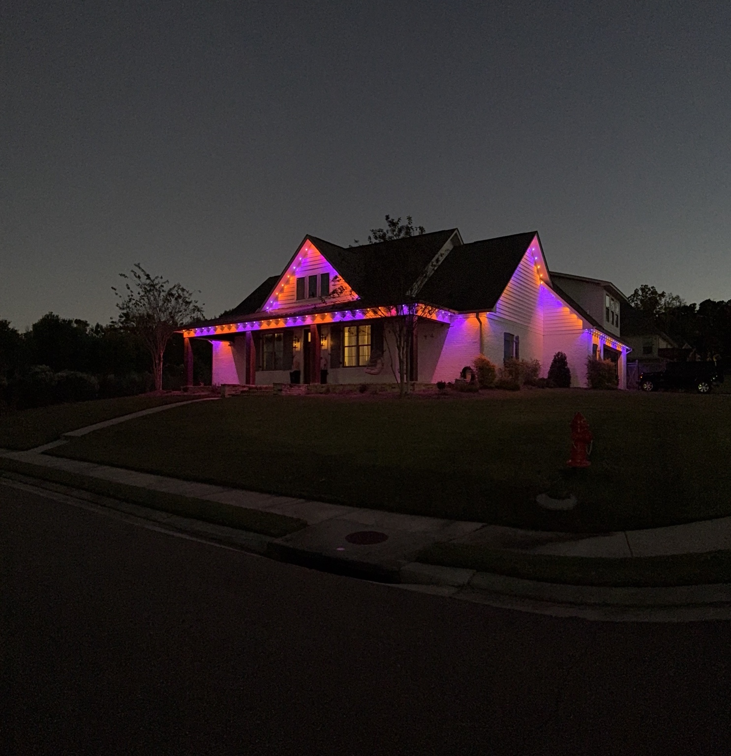 Color-changing permanent exterior lighting installed on a home