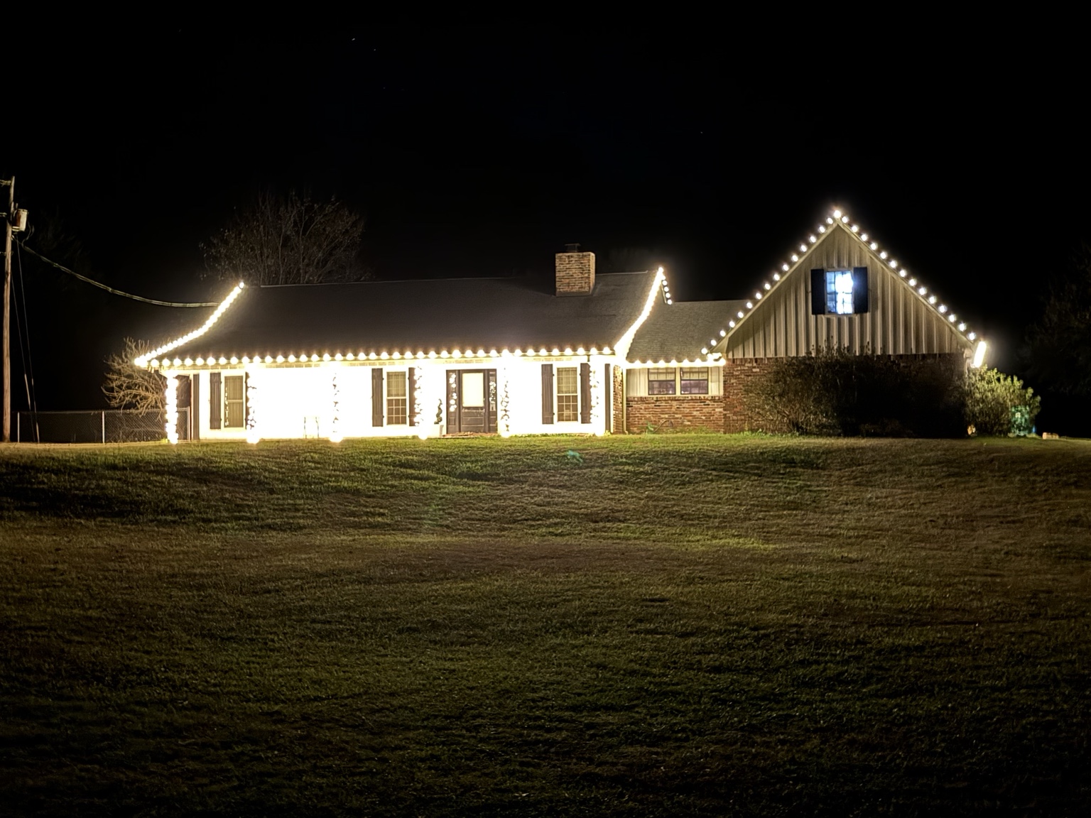 Warm white roofline lights on a residential home