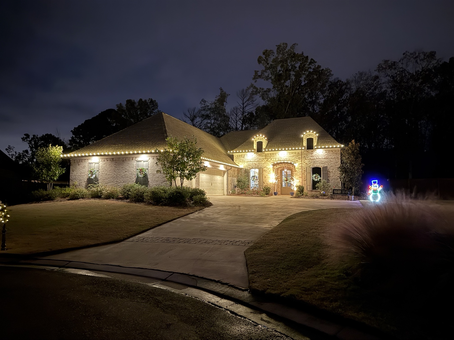 Residential warm white roofline Christmas lighting